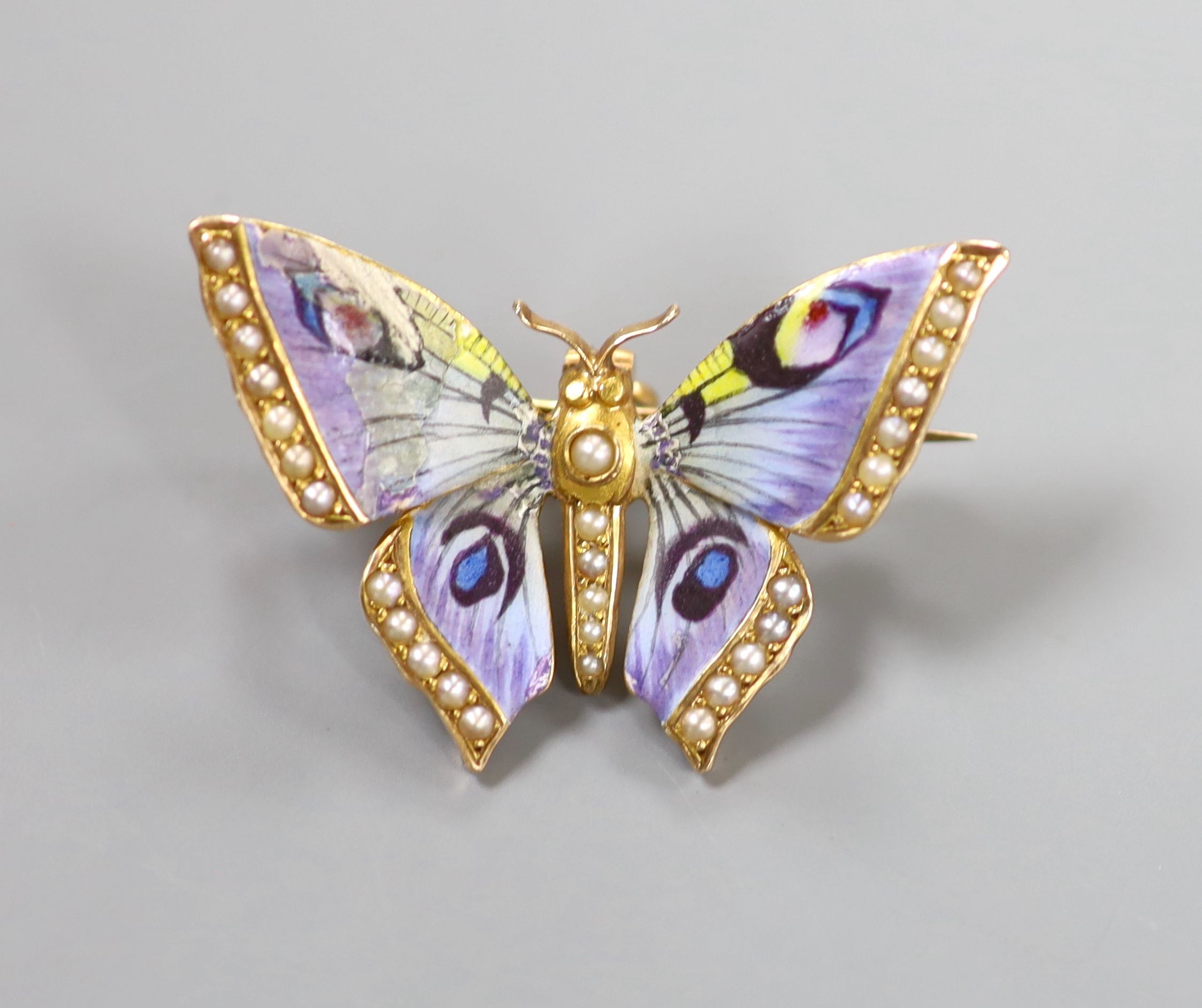 A yellow metal, enamel and split pearl set butterfly pendant brooch (enamel a.f.), 35mm, gross weight 6 grams.